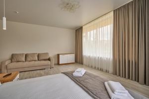 Postel nebo postele na pokoji v ubytování Готель У Борисовича & SPA