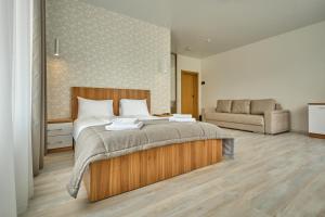 Postel nebo postele na pokoji v ubytování Готель У Борисовича & SPA