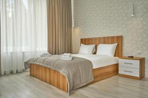 Postel nebo postele na pokoji v ubytování Готель У Борисовича & SPA