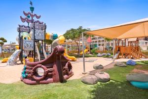 a park with a playground with a play equipment at Pickalbatros White Beach Resort - Hurghada in Hurghada