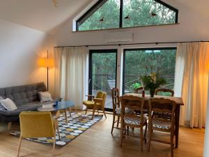 a living room with a table and a couch at Osada Zaborek in Janów Podlaski