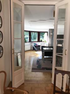 a living room with a door leading into a living room at Woanders zu Hause 4 Sterne FeWo in Kölbingen
