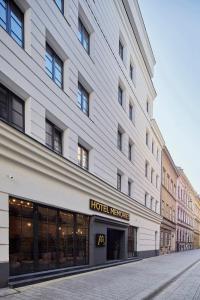 a large building with a hotel vacancies sign on it at Hotel Memories OldTown in Budapest