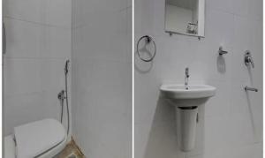維沙卡帕特南的住宿－FabHotel Prime Lorven，白色的浴室设有卫生间和水槽。