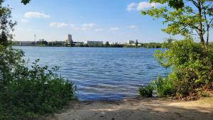 a view of a large body of water at La maison dans le jardin in Viry-Châtillon