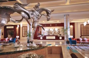 a statue of a horse in a hotel lobby at Pickalbatros White Beach Resort - Hurghada in Hurghada