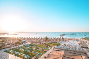 a view of a resort with a pool and the ocean at Pickalbatros White Beach Resort - Hurghada in Hurghada
