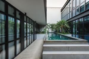 an external view of a building with a swimming pool at Lisbon Five Stars Alcântara Lofts in Lisbon