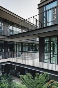 an external view of a building with plants at Lisbon Five Stars Alcântara Lofts in Lisbon