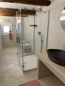 a bathroom with a glass shower and a sink at Dal Console - Piazza Bellini - Napoli in Naples