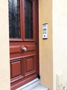 a red door on the side of a building at Studio 11T Sleeps 2 with WiFi in Beausoleil