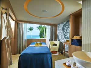 a hotel room with a bed and a sink at Amari Koh Samui in Chaweng