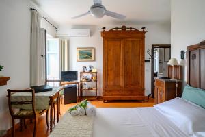 Postel nebo postele na pokoji v ubytování La Vignaredda - Residenza di Charme + 37 fotografií