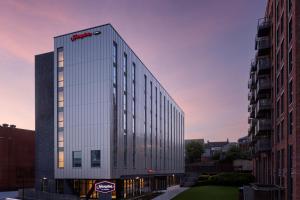 a building with a sota sign on the side of it at Hampton By Hilton Rochdale in Rochdale