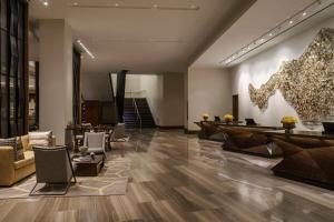 an office lobby with a reception desk and chairs at Hyatt Regency Houston Galleria in Houston