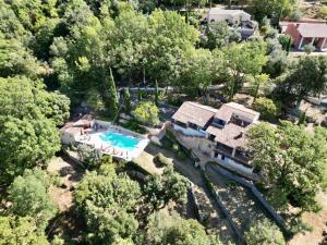 an aerial view of a house with a swimming pool at VILLA CAU B&B - Les Anglores in Claviers