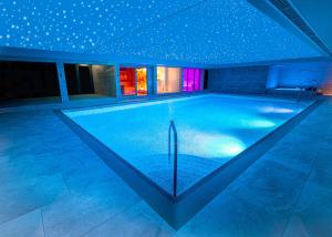 a swimming pool in a house with stars on the ceiling at DoubleTree by Hilton Harrogate Majestic Hotel & Spa in Harrogate