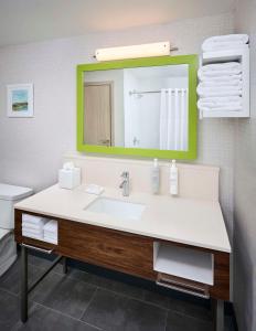 a bathroom with a sink and a mirror at Hampton Inn By Hilton Hamilton in Hamilton