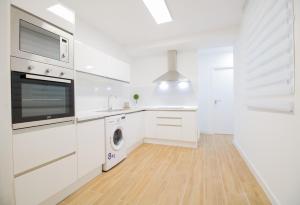 Kuchyň nebo kuchyňský kout v ubytování Las Palmas Smart Rooms