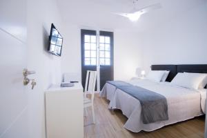 Postel nebo postele na pokoji v ubytování Las Palmas Smart Rooms