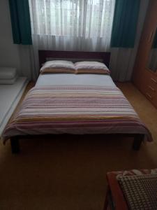 Кровать или кровати в номере Apartment