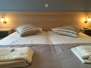 Postel nebo postele na pokoji v ubytování Apollon Hotel