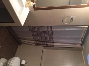 Koupelna v ubytování Apollon Hotel