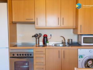 Kuchyňa alebo kuchynka v ubytovaní Apartamento azulera