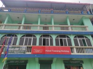 a building with balconies on the side of it at Hotel Tawang Holiday in Tawang