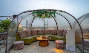 Posezení v ubytování Treebo Premium Baramasi By Jai Club Prime