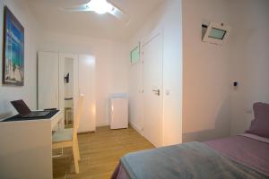 Postel nebo postele na pokoji v ubytování Las Palmas Smart Rooms