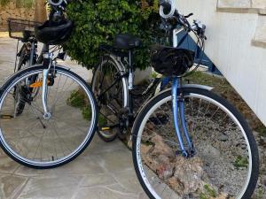 two bikes are parked next to a wall at Can Joan in Santanyi