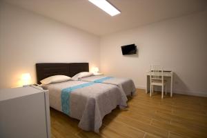 Postel nebo postele na pokoji v ubytování Las Palmas Smart Rooms