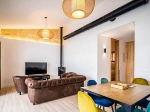 a living room with a couch and a table at Can montis in Palma de Mallorca