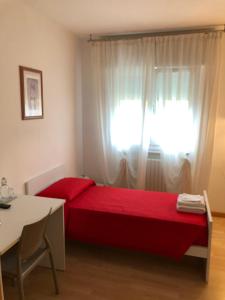 A bed or beds in a room at Bed and Breakfast La Sosta