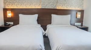 Katil atau katil-katil dalam bilik di Pakons Prime Hotel