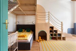 a bedroom with a bunk bed and a staircase at Sopociaki in Sopot