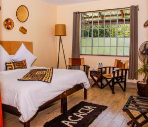 Postel nebo postele na pokoji v ubytování Acacia Tree Lodge + 37 fotografií