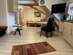 a living room with a table and a dining room at Haus Jehle in Görwihl