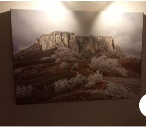 a painting of a mountain on a wall at b&b La Divina Pietra 