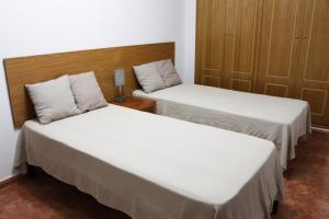 Postel nebo postele na pokoji v ubytování Apartment Gandia Playa Venecia