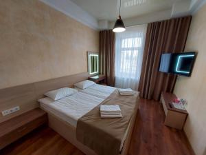 Postel nebo postele na pokoji v ubytování Graff Hotel