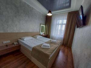 Postel nebo postele na pokoji v ubytování Graff Hotel