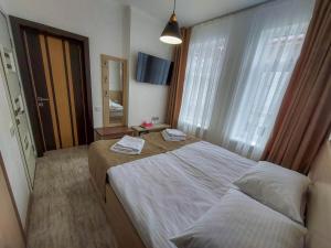 Postel nebo postele na pokoji v ubytování Graff Hotel