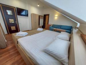 Postel nebo postele na pokoji v ubytování Graff Hotel