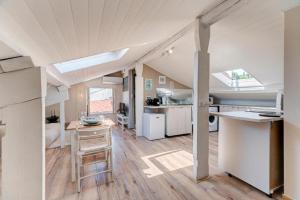a kitchen and dining area of a tiny house at LOVELY STUDIO - Port de Nice in Nice