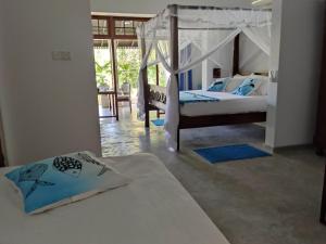 Postel nebo postele na pokoji v ubytování Villa Lyvie ayurvedic hotel + 37 fotografií
