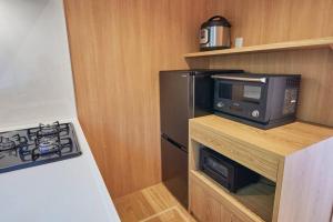 Kuchyň nebo kuchyňský kout v ubytování VOYAN RESORT 伊豆MADOKA