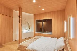 Postel nebo postele na pokoji v ubytování VOYAN RESORT 伊豆MADOKA