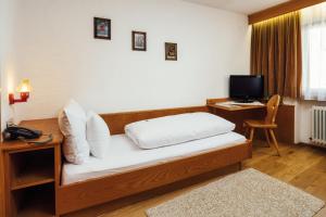 Postel nebo postele na pokoji v ubytování Hotel Komperdell